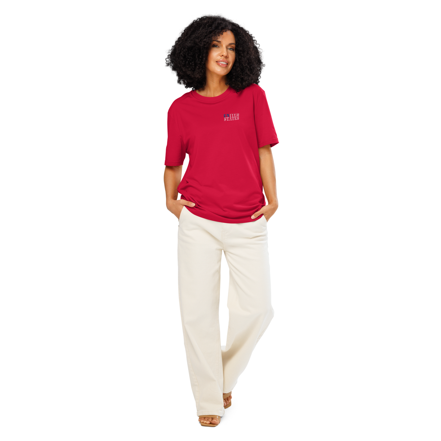 Woman wearing red United States Soccer Shirt from Cut from Glory collection with white pants
